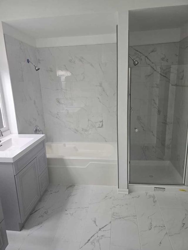 bathroom featuring vanity and separate shower and tub