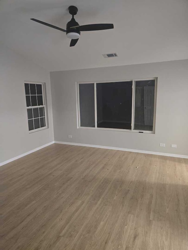 empty room featuring ceiling fan and wood-type flooring