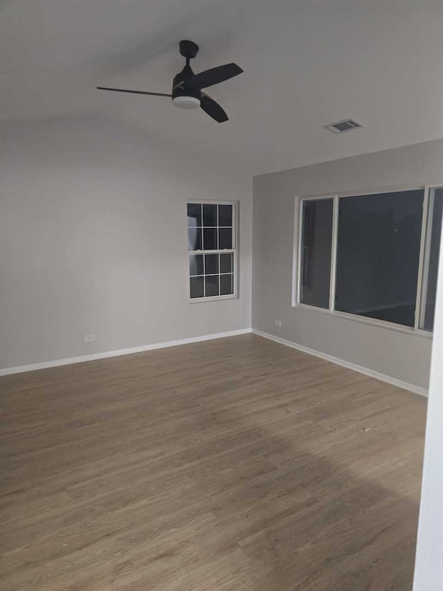 spare room with ceiling fan and wood-type flooring