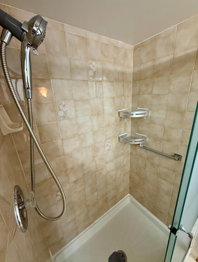 bathroom with tiled shower