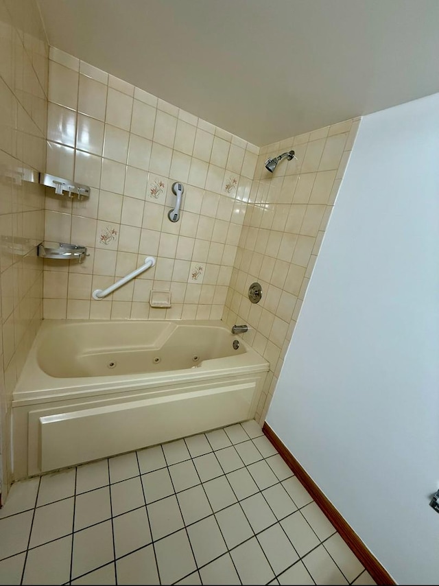 bathroom featuring tile patterned floors and tiled shower / bath