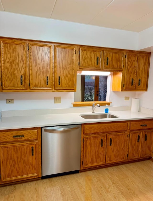 kitchen featuring dishwasher, light hardwood / wood-style floors, and sink