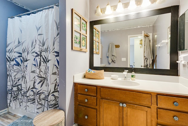 bathroom featuring vanity and wood-type flooring