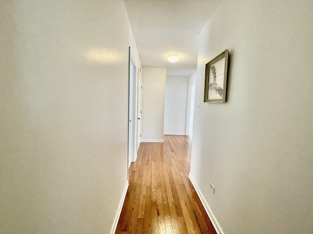 hallway with light wood-type flooring