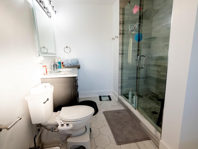 bathroom with vanity, an enclosed shower, and toilet