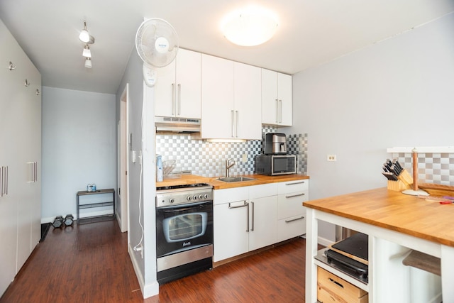 kitchen featuring wood counters, white cabinetry, sink, and appliances with stainless steel finishes