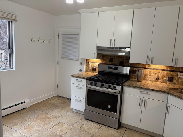 kitchen featuring white cabinets, stainless steel gas stove, a baseboard radiator, and backsplash