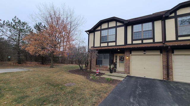 view of front facade featuring a garage and a front lawn