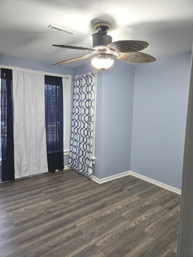 unfurnished room featuring dark hardwood / wood-style floors and ceiling fan