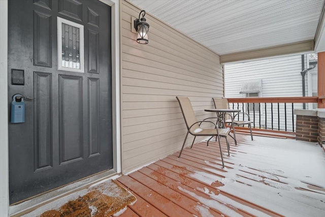 wooden deck featuring covered porch