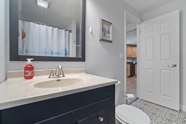 bathroom with vanity and toilet