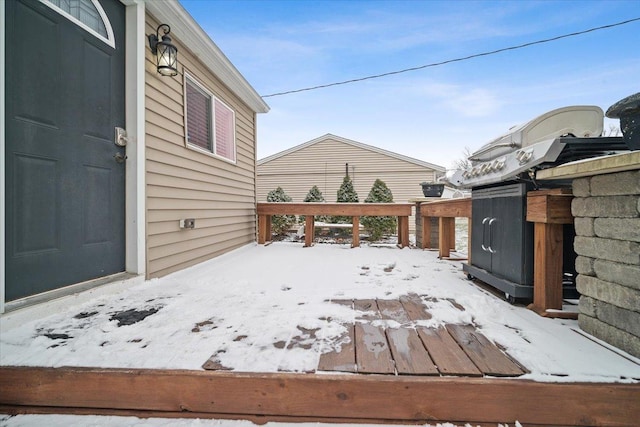 view of snow covered deck