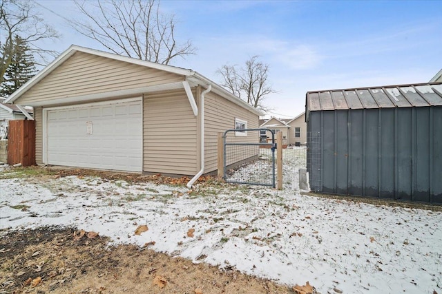 view of snow covered garage