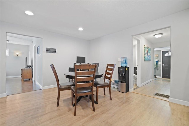 dining room featuring light wood-type flooring