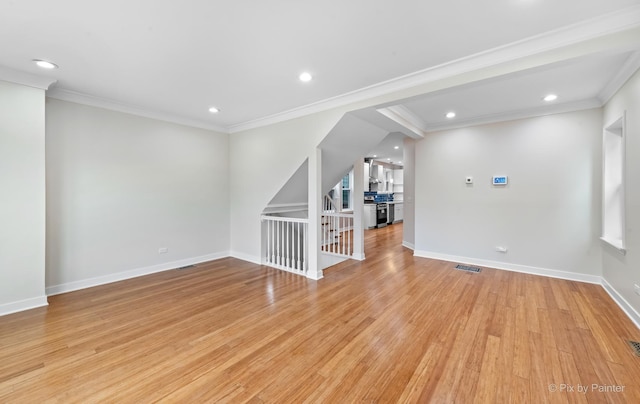 interior space with ornamental molding and light wood-type flooring