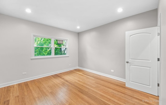 unfurnished room with light hardwood / wood-style flooring