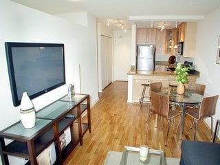 living room featuring light hardwood / wood-style floors and track lighting