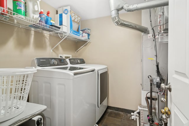 clothes washing area featuring separate washer and dryer