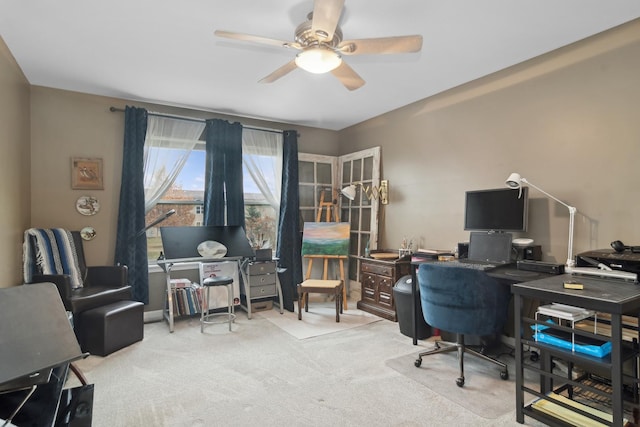 office featuring ceiling fan and light carpet