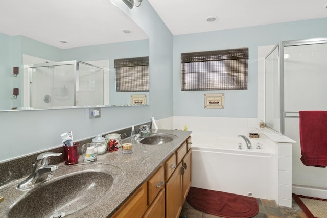 bathroom with vanity and independent shower and bath