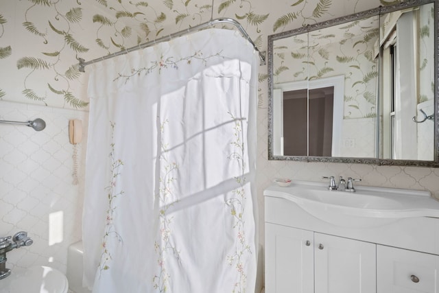 bathroom with shower / bath combination with curtain and vanity