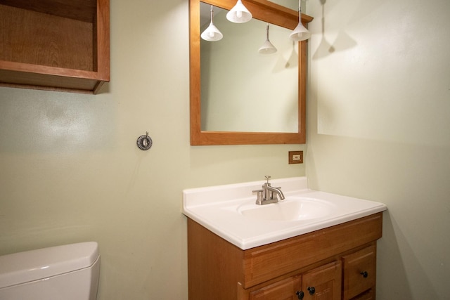 bathroom featuring toilet and vanity