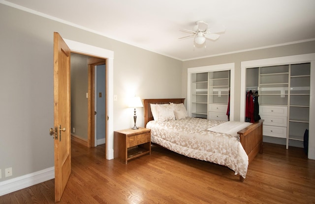 bedroom with ceiling fan, hardwood / wood-style flooring, and crown molding