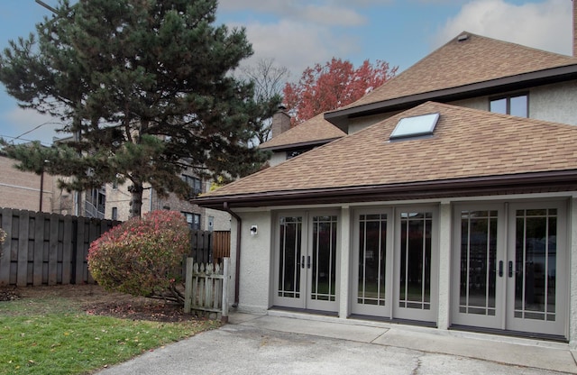 back of property featuring french doors