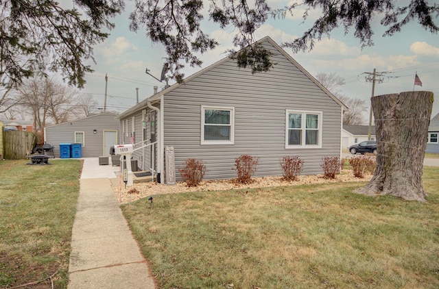 view of side of property with a yard