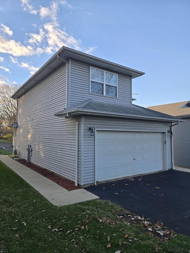 view of property exterior featuring a garage