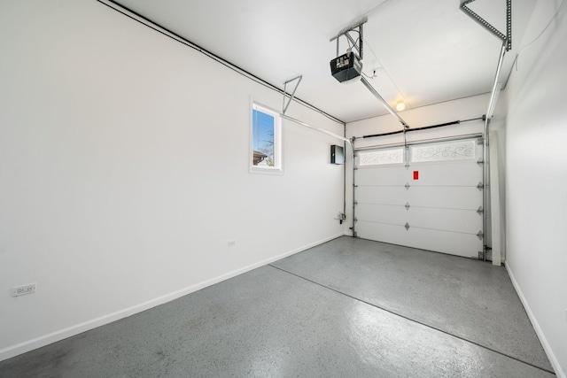 garage featuring baseboards and a garage door opener