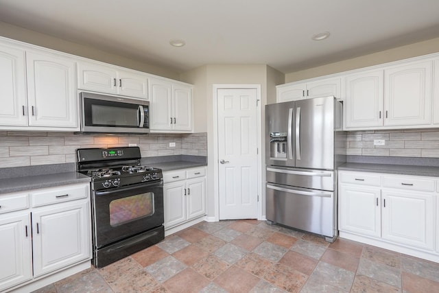 kitchen with backsplash, white cabinets, and stainless steel appliances