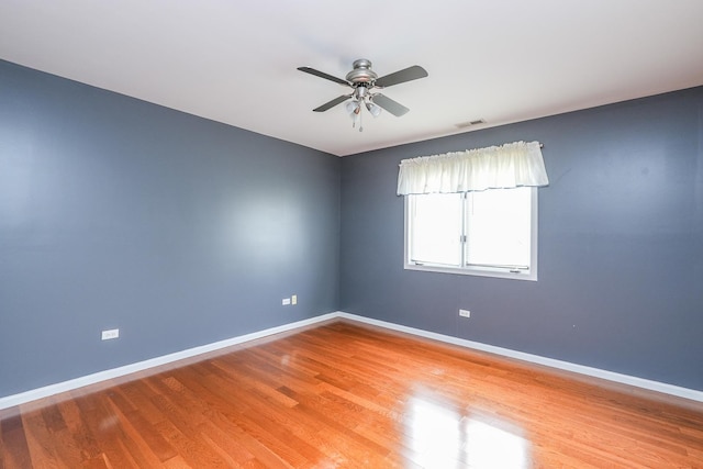 spare room featuring ceiling fan and light wood-type flooring