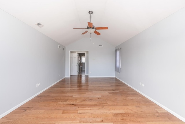 unfurnished room with ceiling fan, wood-type flooring, and vaulted ceiling