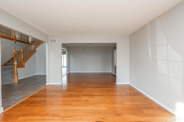 spare room with light hardwood / wood-style floors