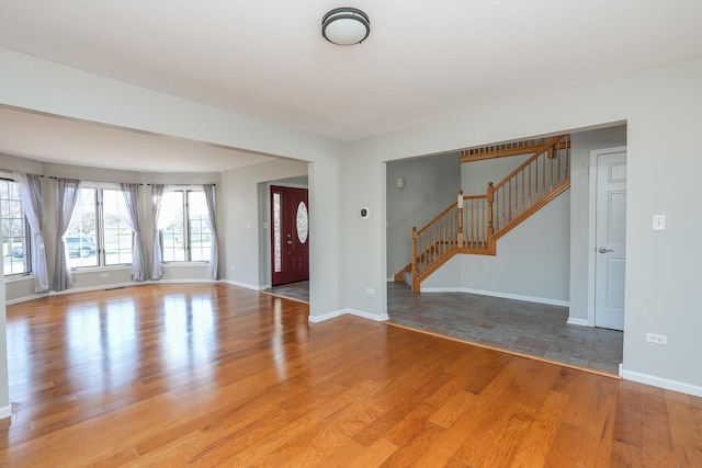 unfurnished living room with light hardwood / wood-style flooring