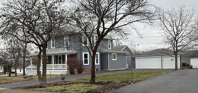 view of front of home featuring a porch and a garage