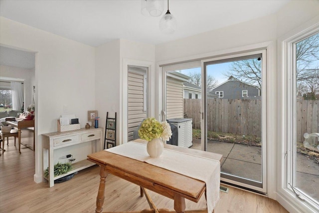 dining room with light wood-type flooring