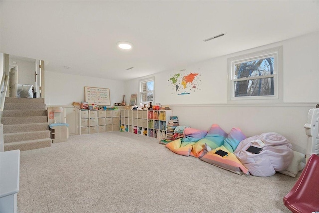 recreation room featuring carpet floors and a healthy amount of sunlight