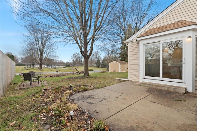 view of yard with a patio area and a shed