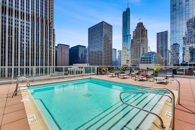 view of swimming pool featuring a patio