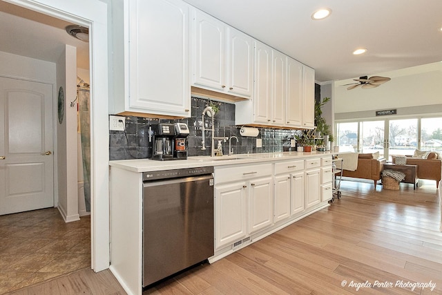 kitchen with ceiling fan, dishwasher, white cabinets, and light hardwood / wood-style floors