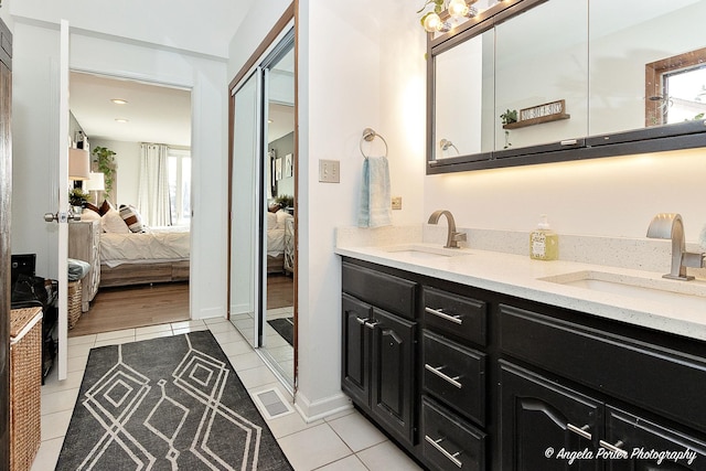 bathroom featuring tile patterned flooring and vanity