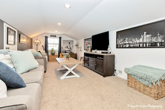 living room with carpet flooring and vaulted ceiling