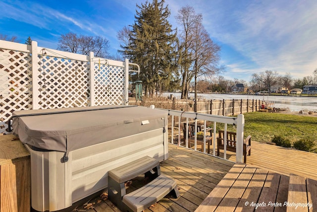 wooden terrace with a hot tub