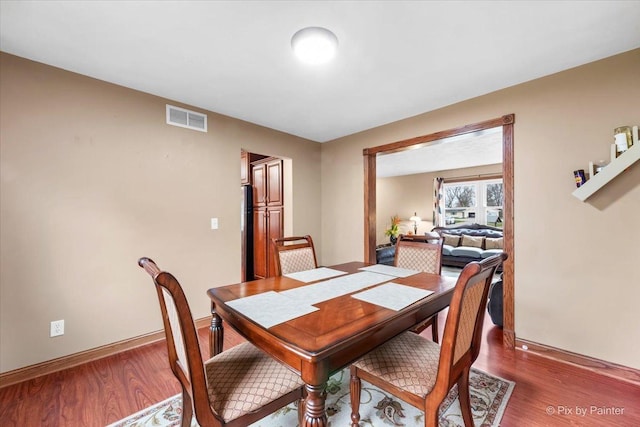 dining area featuring hardwood / wood-style flooring