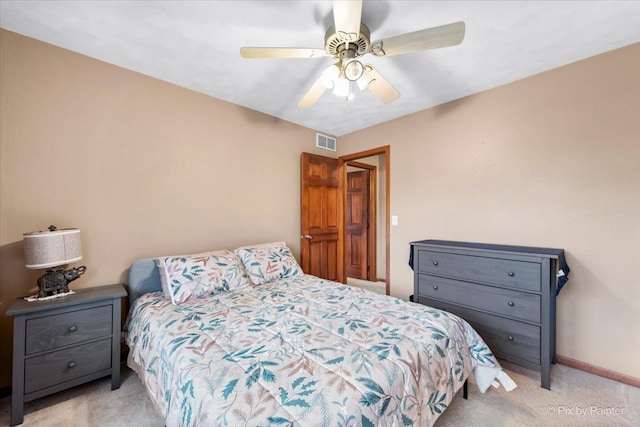 bedroom with light carpet and ceiling fan