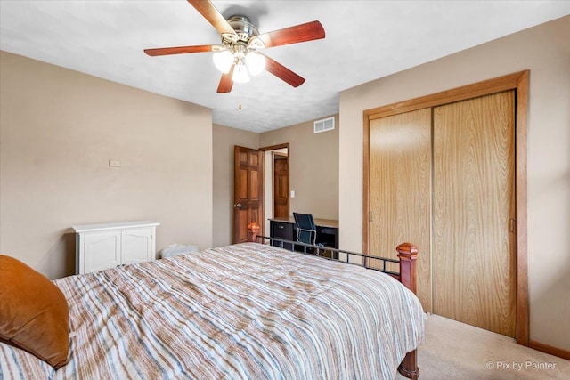 bedroom with carpet flooring, a closet, and ceiling fan