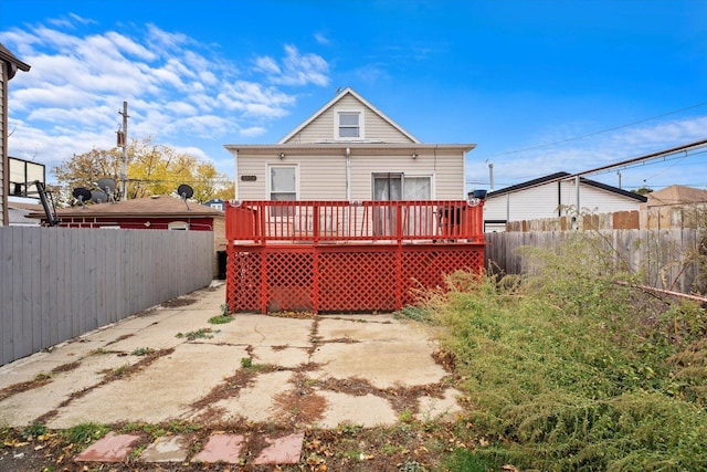 back of property featuring a deck