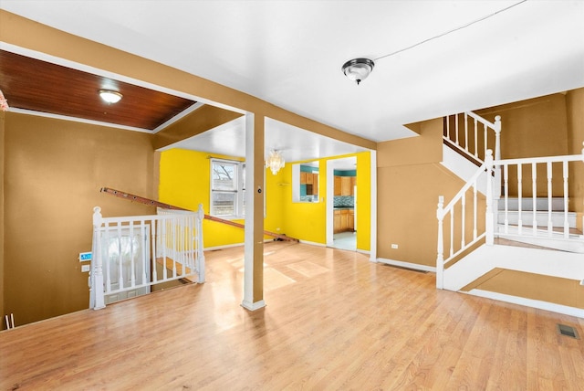 interior space featuring wood ceiling, a chandelier, and wood-type flooring